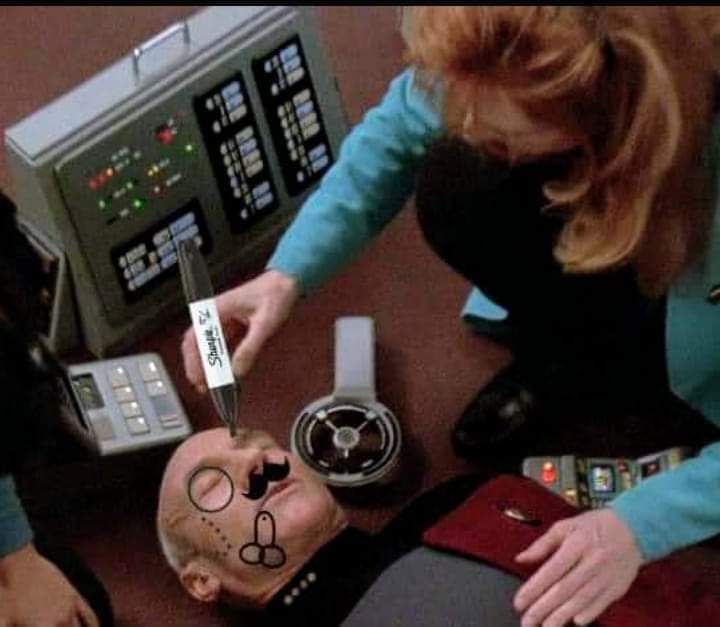 The meme is a picture of a scene from Star Trek: The Next Generation, where a character is being treated by a doctor. The doctor is using a medical device to remove a "laser" beam from the character's eye, but it's actually a pencil being held by the doctor. The text "laser" is written on the pencil, implying that the doctor is trying to remove a pencil from the character's eye.